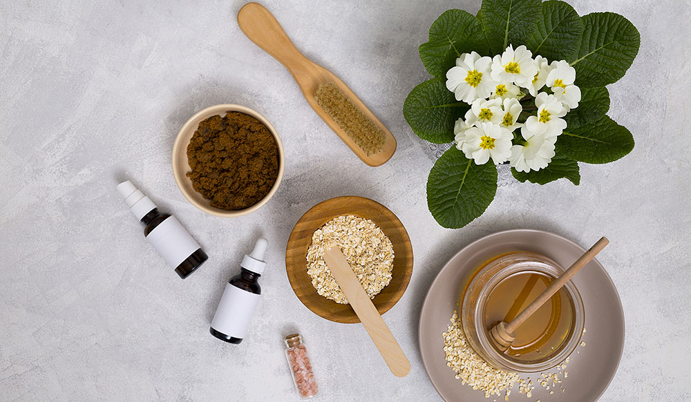 https://www.freepik.com/free-photo/wooden-brush-honey-oats-himalayan-rock-salt-essential-oil-bottle-with-primula-flowers-vase-concrete-background_4173781.htm